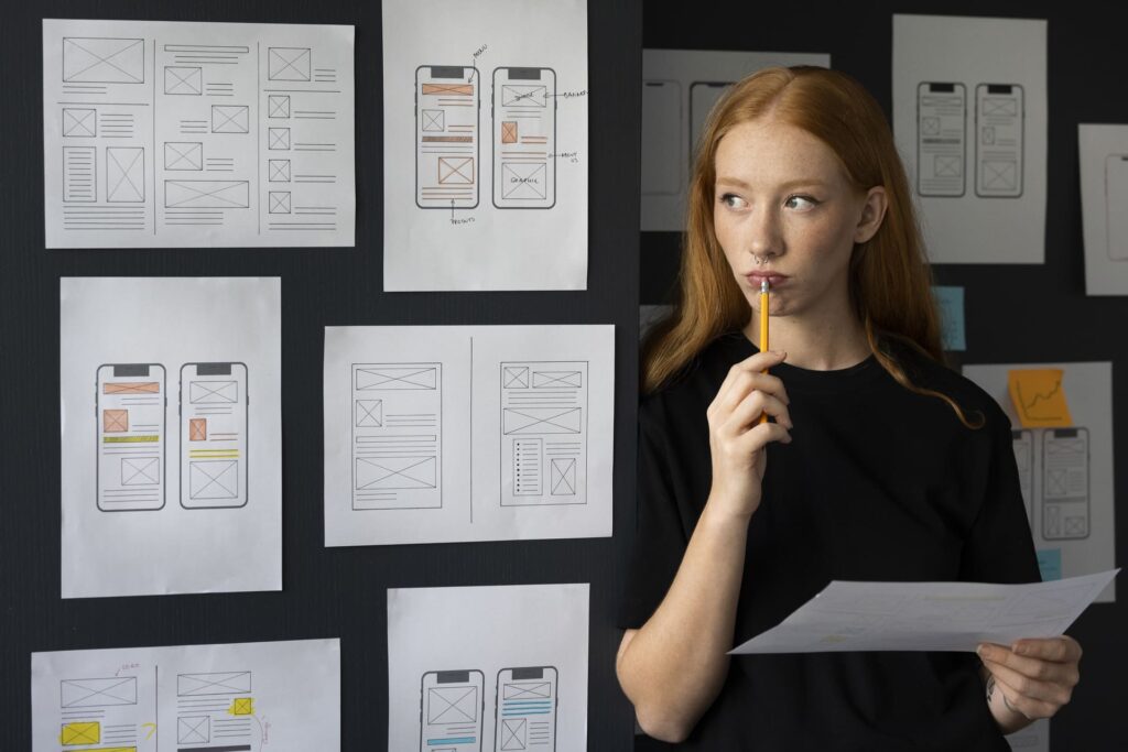 Woman next to dashboard reflecting website structure across devices